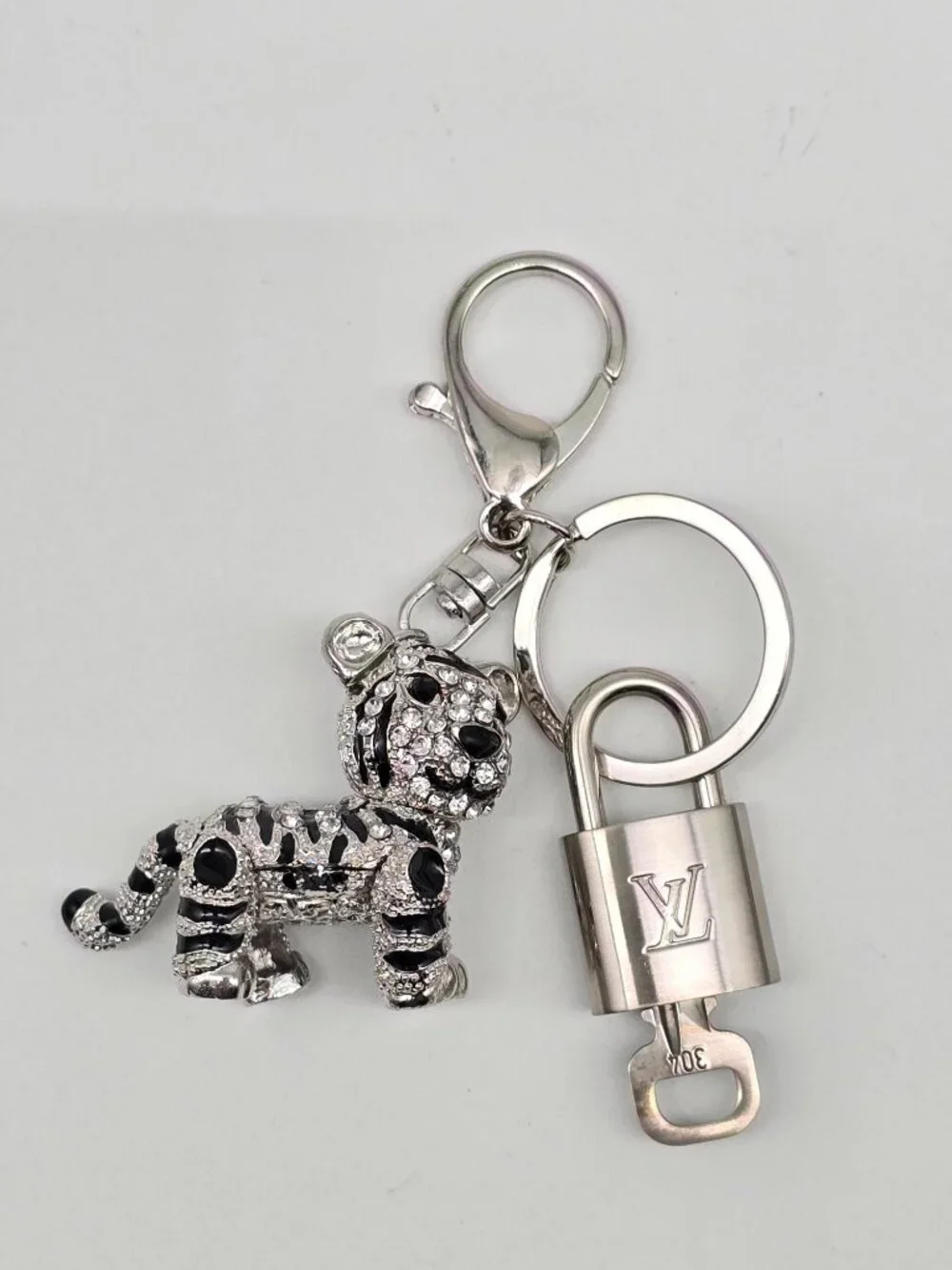 Authentic Louis Vuitton Silver Padlock with Unbranded Silver Tiger Bagcharm